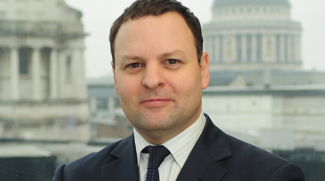 Headshot of Richard East with St Paul's Cathedral in the background