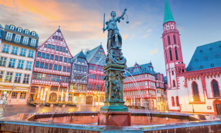 The Lady of Justice statue and fountain at twilight in Frankfurt's old town