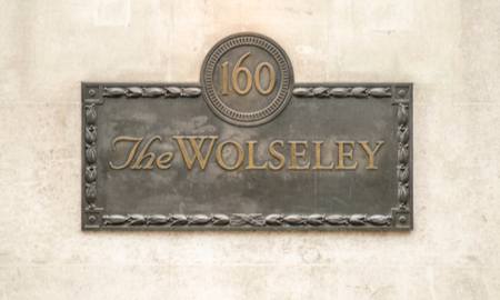 The Wolseley sign on exterior of building. An art deco luxury cafe restaurant in Mayfair, London.