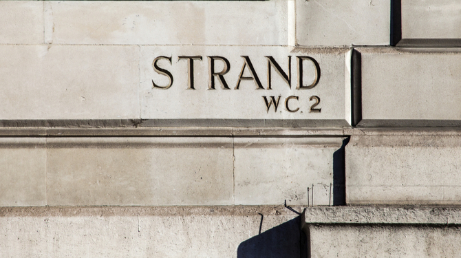 An Etched street sign for the Strand. A famous street in central London.